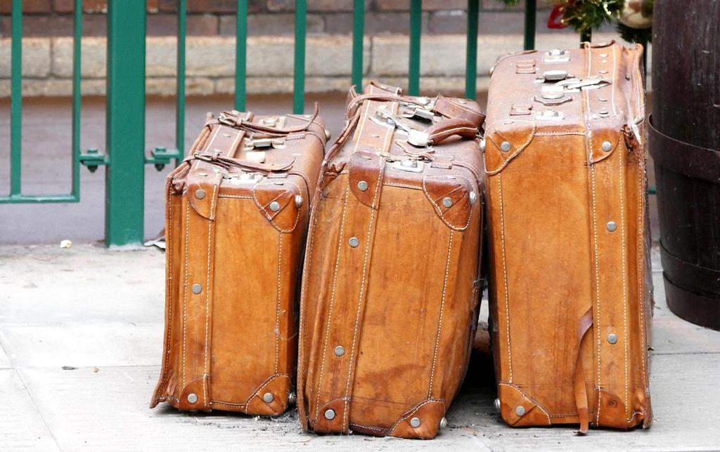 Traveler packing a suitcase efficiently