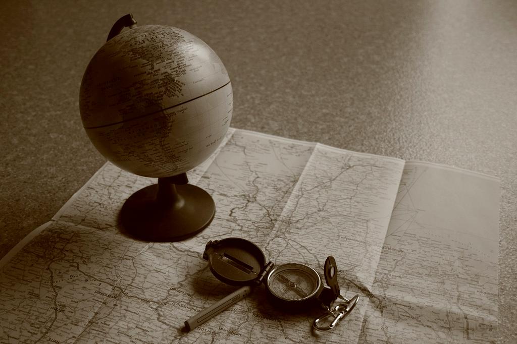 Person planning travel itinerary on laptop